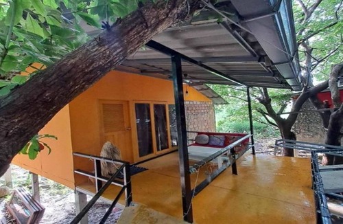 Baan Tai House | Cozy Room with Private Bathroom, Balcony, and Free Wi-Fin