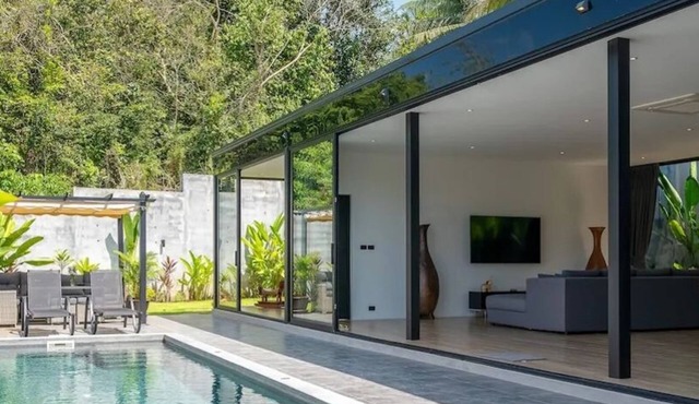 Modern 2-bedroom oasis with private pool, garden, and dedicated workspace, ideal for families