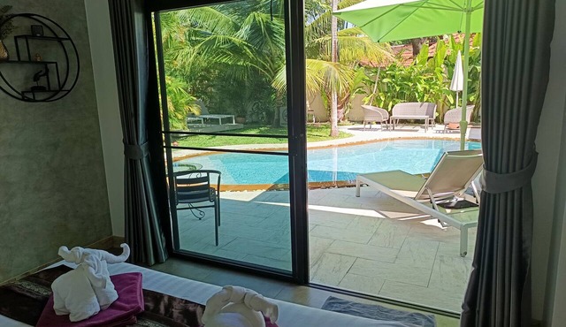 Paradise Island Villa 3 features a private swimming pool in a luxurious tropical park.
