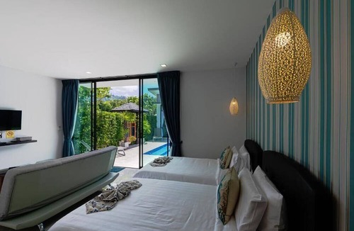 Si Sunthon Villa | Lespalm Resort by Vacayandco