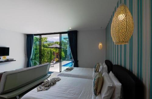 Si Sunthon Villa | Lespalm Resort by Vacayandco